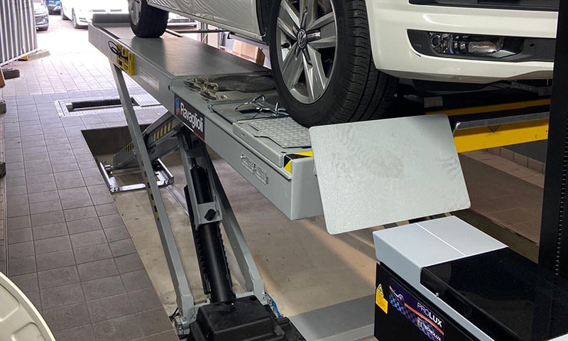 Vehicle lift in garage workshop