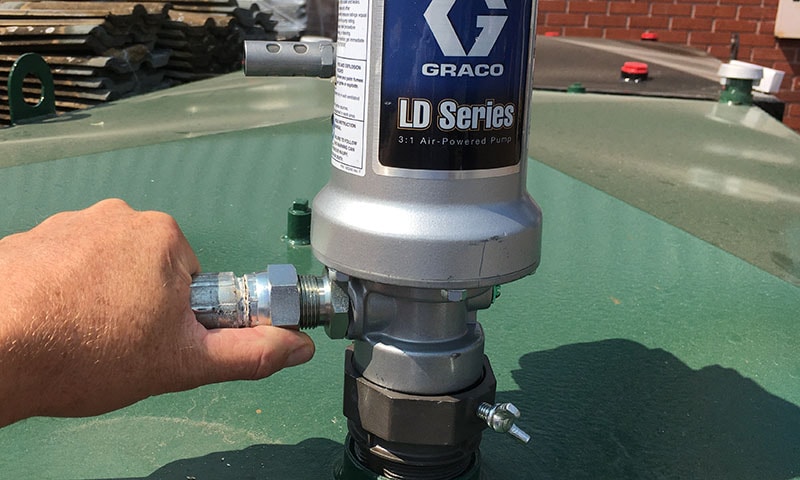 Technician servicing liquid engineering equipment