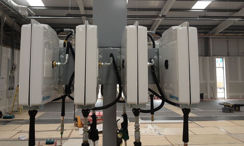 Qualified technician installing industrial liquid engineering pipework
