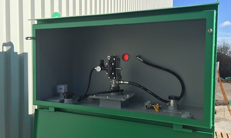 Remote fill cabinet and oil tank pipework