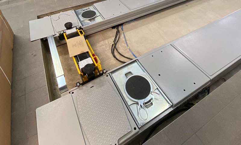 Wheel alignment geometry check in an MOT bay workshop